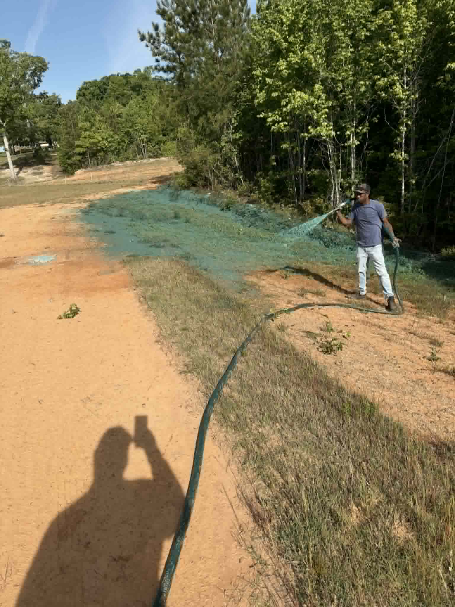 Hydro seeding application in progress on a residential property
